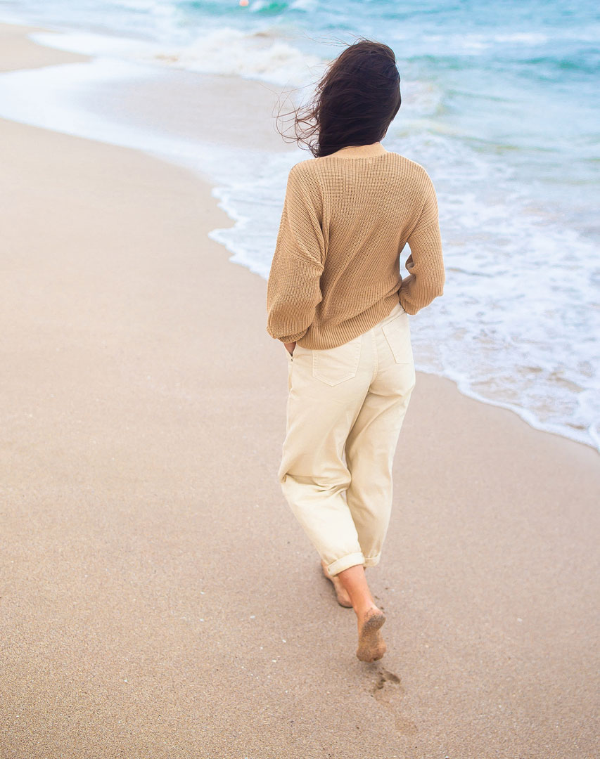 woman walking on the beach